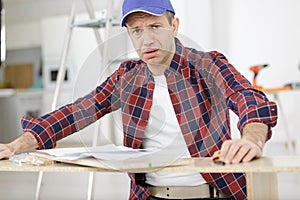 craftsmen man having doubts with confuse face expression