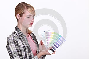 Craftswoman holding a color chart