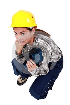 Craftswoman holding a drill