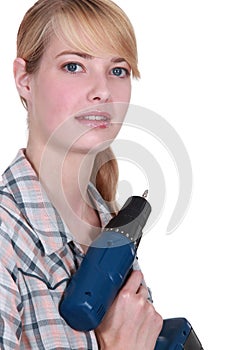 Craftswoman holding a drill