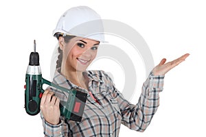 Craftswoman holding a drill