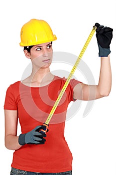 Craftswoman holding a meter