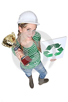 Craftswoman holding a recycling label