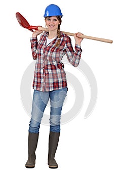 Craftswoman holding a shovel
