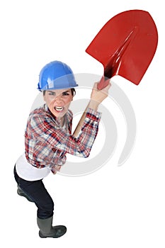 Craftswoman holding a shovel