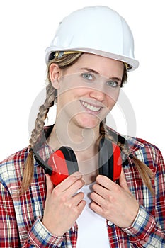 Craftswoman wearing earphones