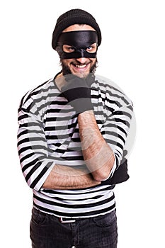 Crafty robber smiling and thinking photo