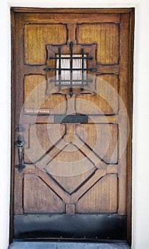 Crafty wooden door with small window photo