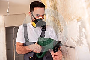 Crafty worker removing porcelain tiles