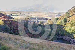 Craig Goch Dam and reservoir from distance, evening light, fall photo