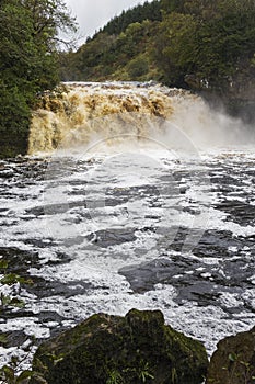 Crammel Linn waterfall on the Norhumberland Cumbria border, UK in full flow photo