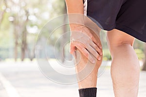 Cramp in leg while exercising. Sports injury concept photo