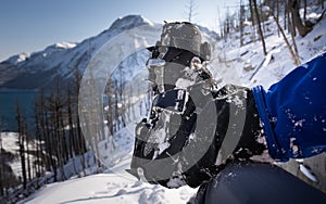 Crampons attached to hiking boots for traction