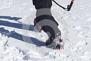 Crampons for ice climbing mounted on Hanwag Omega mountaineering boots