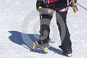 Crampons for ice climbing mounted on Hanwag Omega mountaineering boots