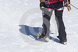 Crampons for ice climbing mounted on Hanwag Omega mountaineering boots