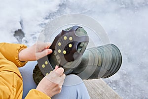 Crampons on rubber pad, ice grips for footwear, over boot attached traction cleats, 10 anti slip spikes.