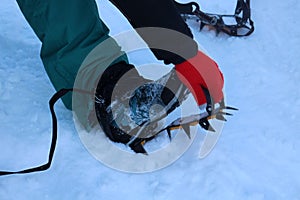 Crampons on trekking shoes in High Tatras