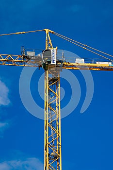 Cran Construction equipment over building construction site silhouette on sunset sky amazing colorful cloud background in the