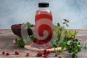 Cranberries and cranberry juice in a plastic bottle