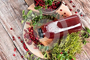 Cranberries and cranberry juice in a plastic bottle