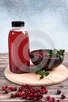 Cranberries and cranberry juice in a plastic bottle