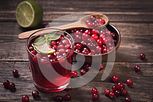 Cranberry juice on old wooden table photo