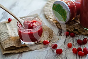 Cranberry marmelade  with fresh fruit on wooden background