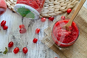 Cranberry marmelade  with fresh fruit on wooden background