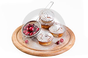 Cranberry muffins on a round board