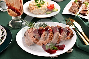 Cranberry pate and other traditional Christmas Eve dishes on festive table