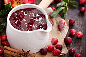 Cranberry sauce in ceramic saucepan photo