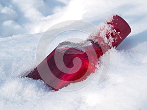 Cranberry vodka in the snow