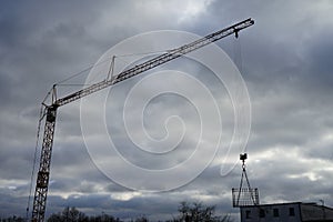 A crane against the sky at a construction site. Berlin, Germany