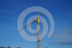 A crane against the sky at a construction site. Berlin, Germany