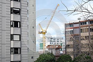 Crane in Auckland CBD with apartment buildings and office blocks