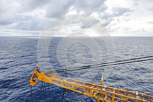 Crane boom structure and metal sling on blue sky background