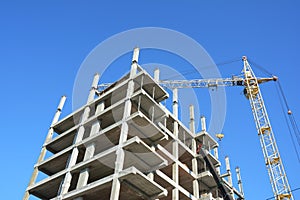 Crane Building New House on the Construction Site. House building good for economic growth.