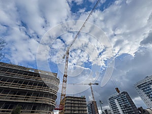 Crane and building under construction. Housing construction, apartment block