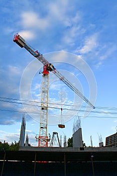 The crane builds the house