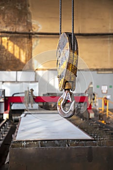 Crane clevis sling hook in an industrial factory.