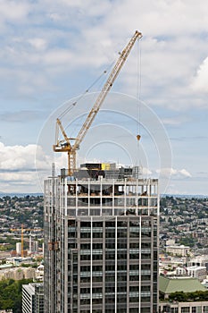 Crane constructing skyscraper photo