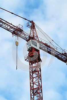 Crane, construction and blue sky background for building with heavy metal, steel or machinery outdoor. Hoist in city