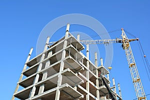 Crane Construction. Building cranes on construction site with builders.