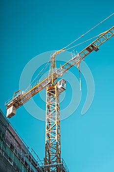 Crane on construction site background.
