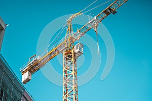Crane on construction site background.