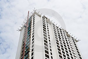 Crane construction site condominium residence apartment skyscraper blue sky