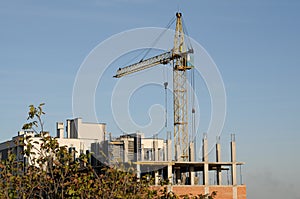 Crane at construction site in front of sky