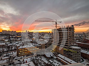Crane in the construction site under the sunset