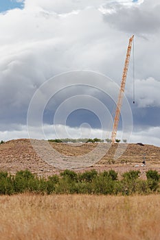 Crane for the construction of a wind turbine in the middle of the field